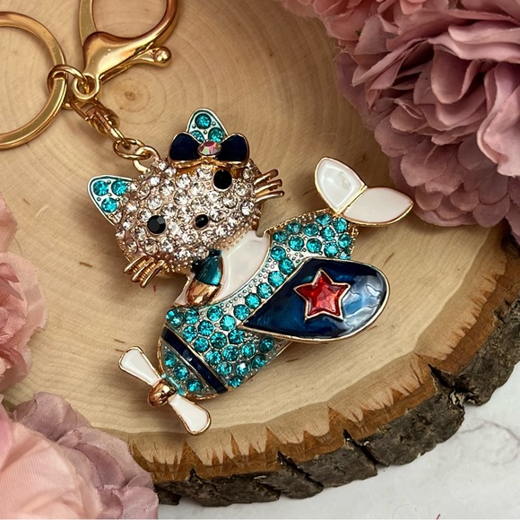 Hello Kitty Flying a Bkue Crystal Airplane Keychain Charm - Picture 11 of 16